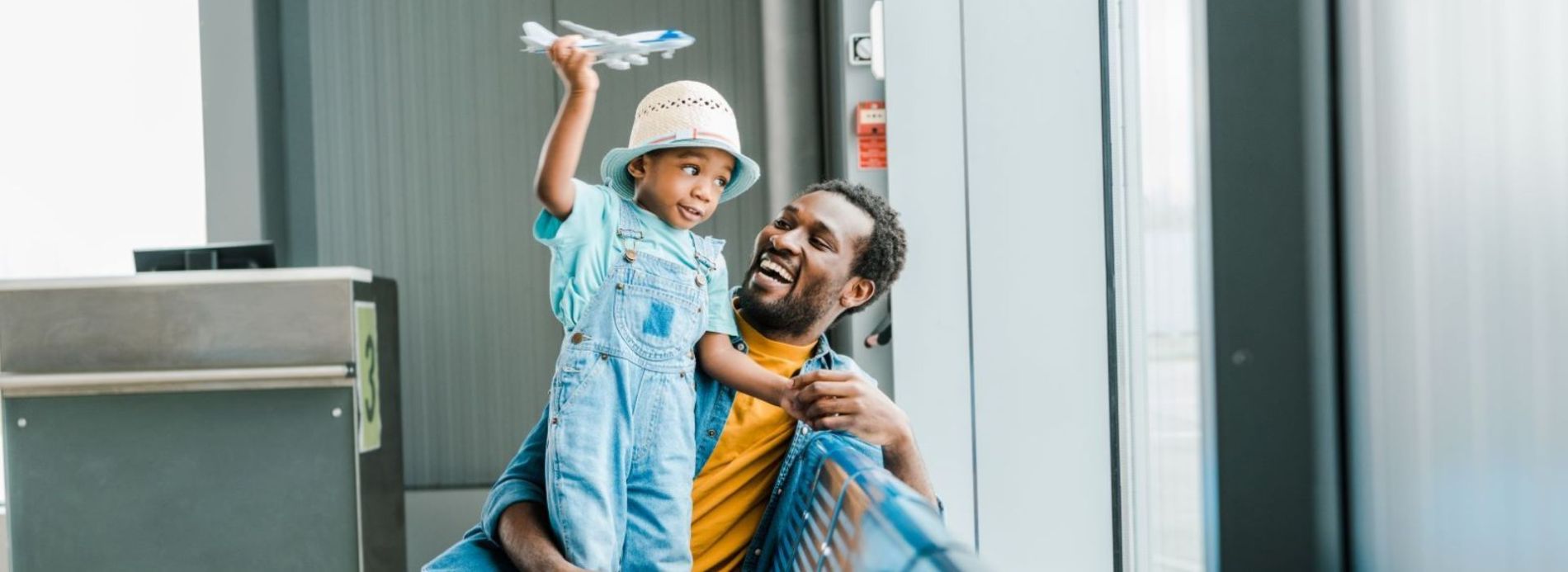 man and child at airport