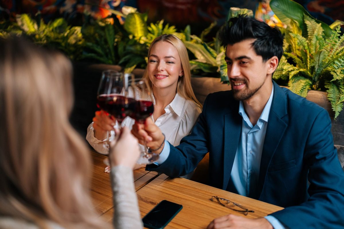 Table clinking wine glasses