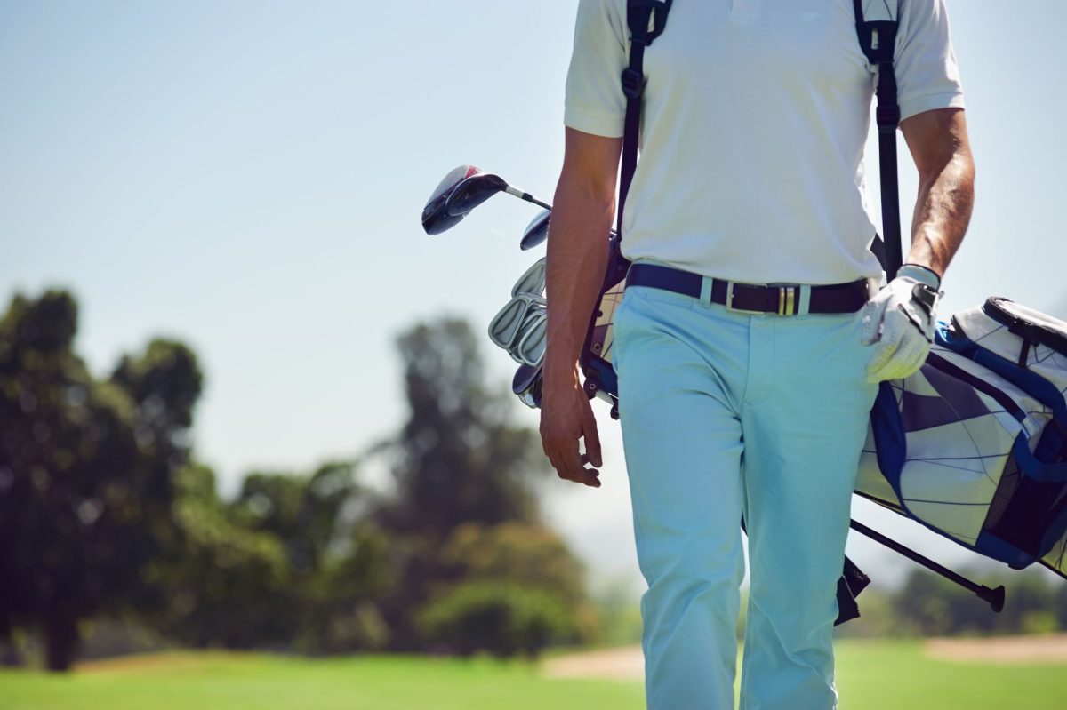 Man with golf clubs