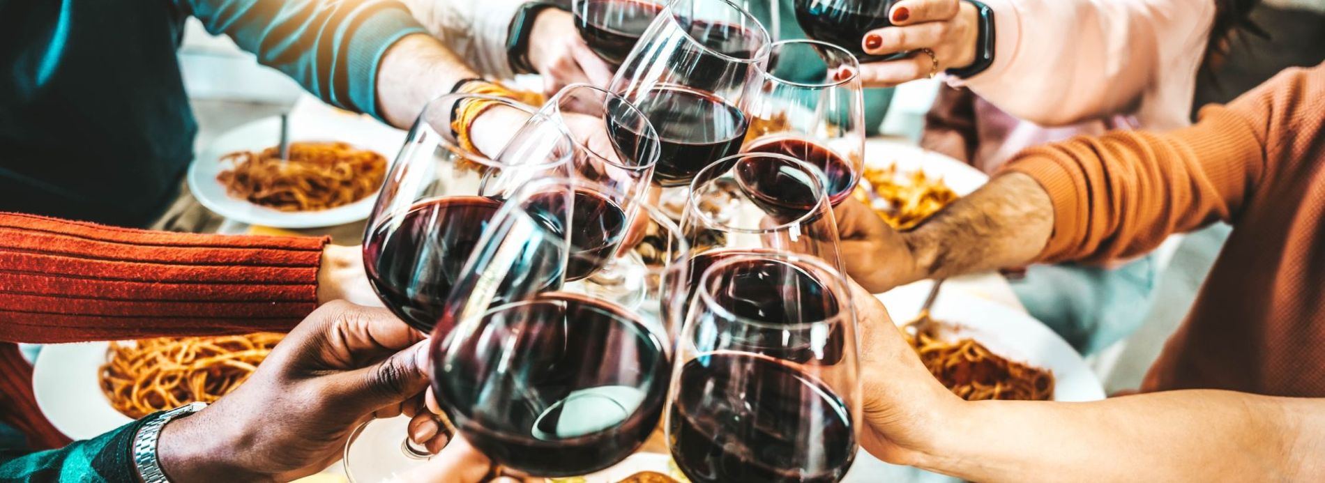 Toasting with glasses of wine at restaurant