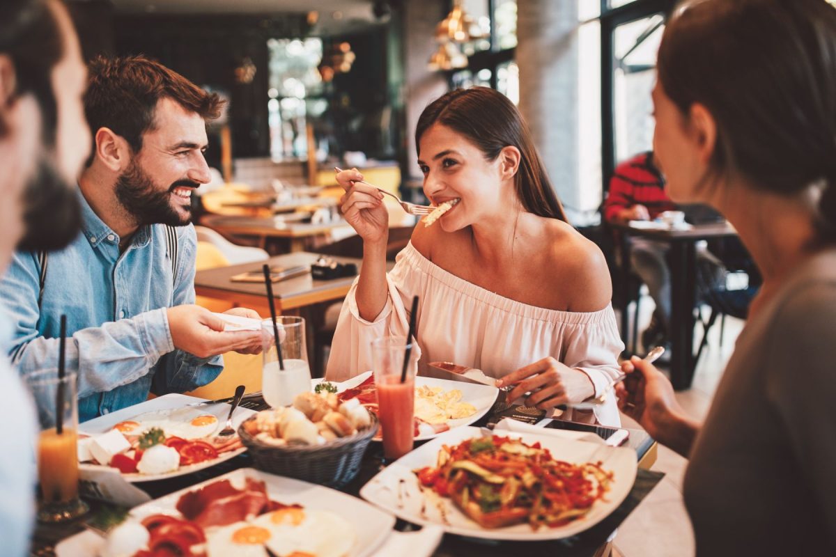 Friends dining at restaurant